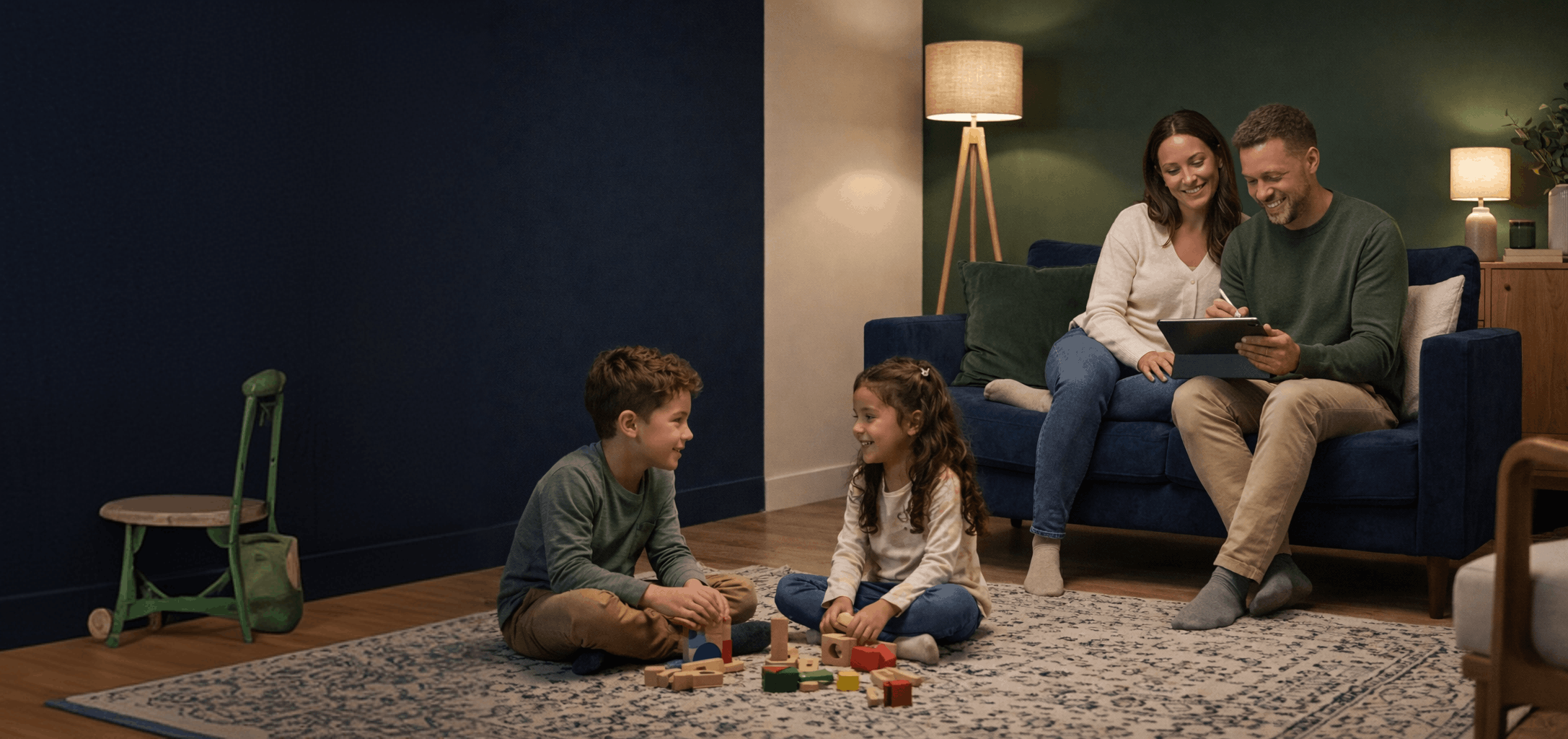 A family sitting in a room smiling