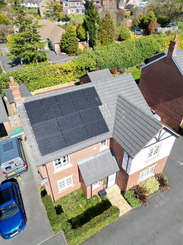 Aerial view of house with solar panels